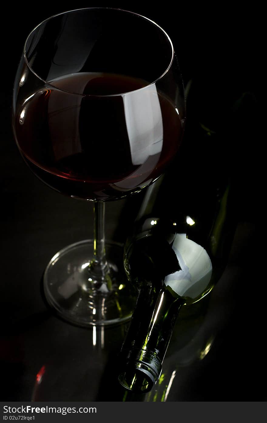 Glass of red wine on a dark background