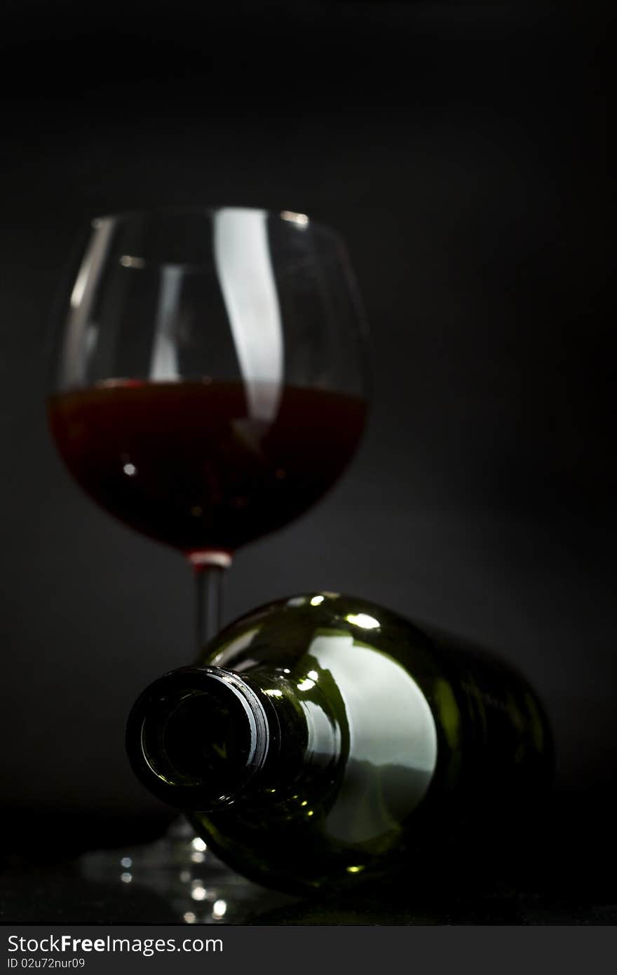 Glass of red wine on a dark background