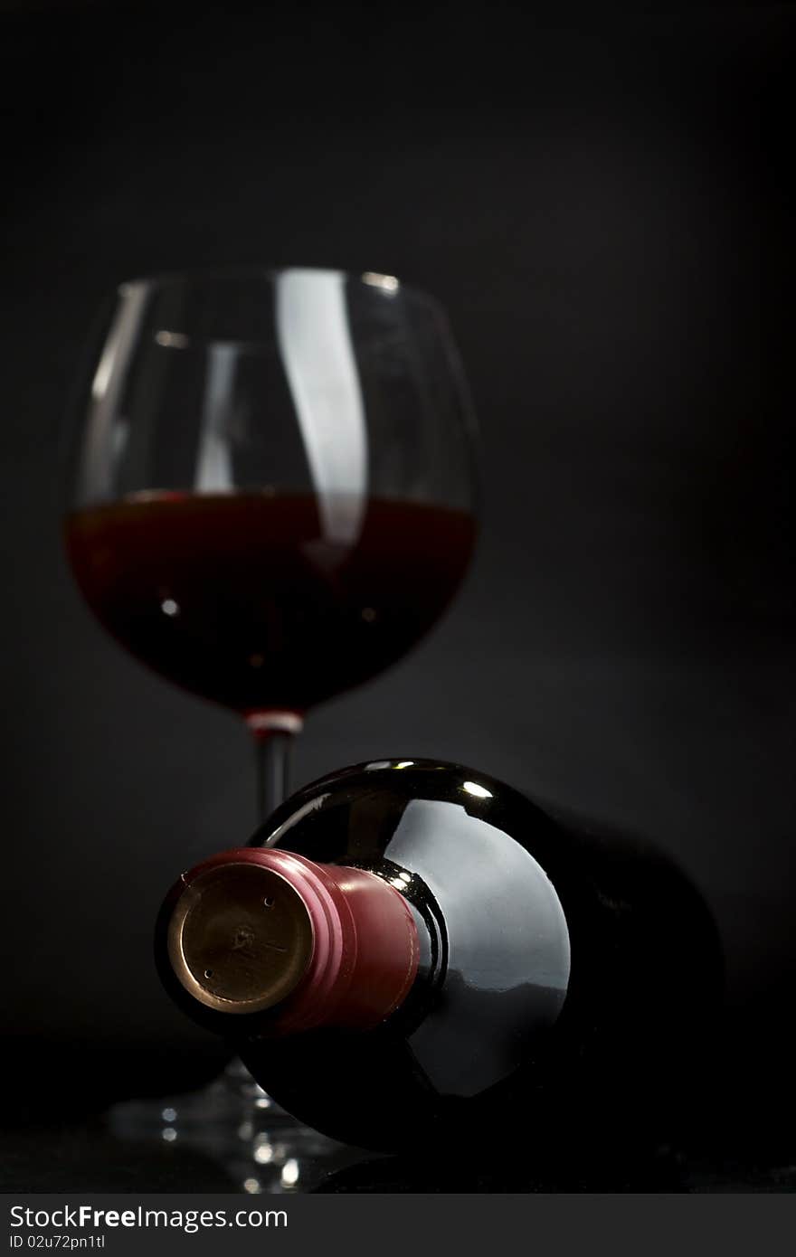 Glass of red wine on a dark background