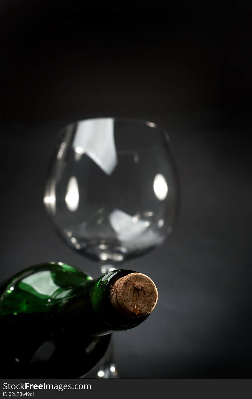 Bottle of red wine on a dark background