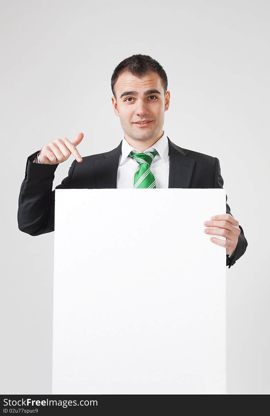 Businessman pointing to white blank card