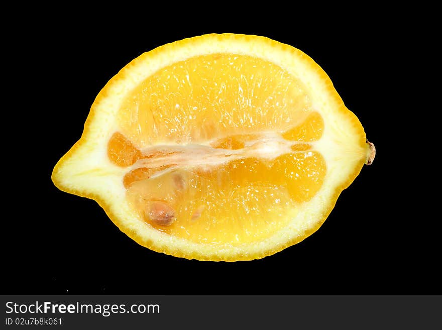 Yellow lemon on black background.