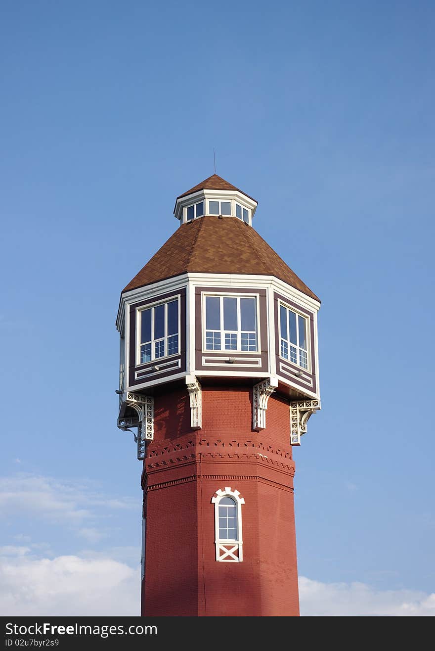 Fire tower against the  blue sky