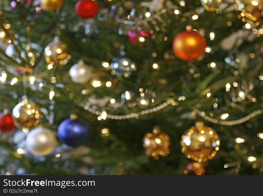 Blurred background from christmas tree with baubles and the lights