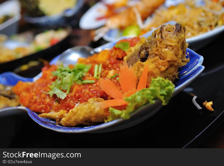 Plate of fried grouper with chilli topping