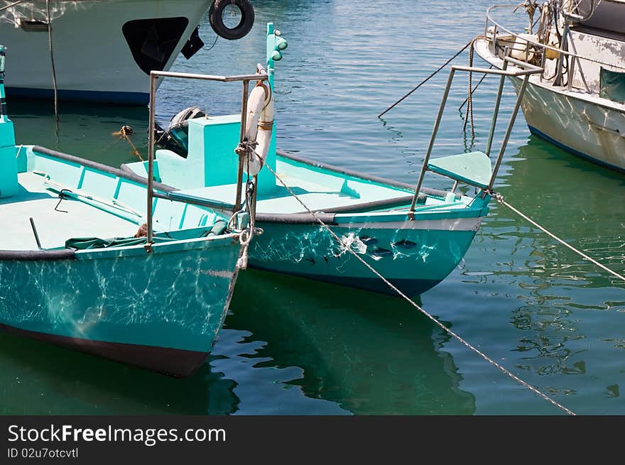 Colorful boats docked in the port. Summer afternoon. Colorful boats docked in the port. Summer afternoon.