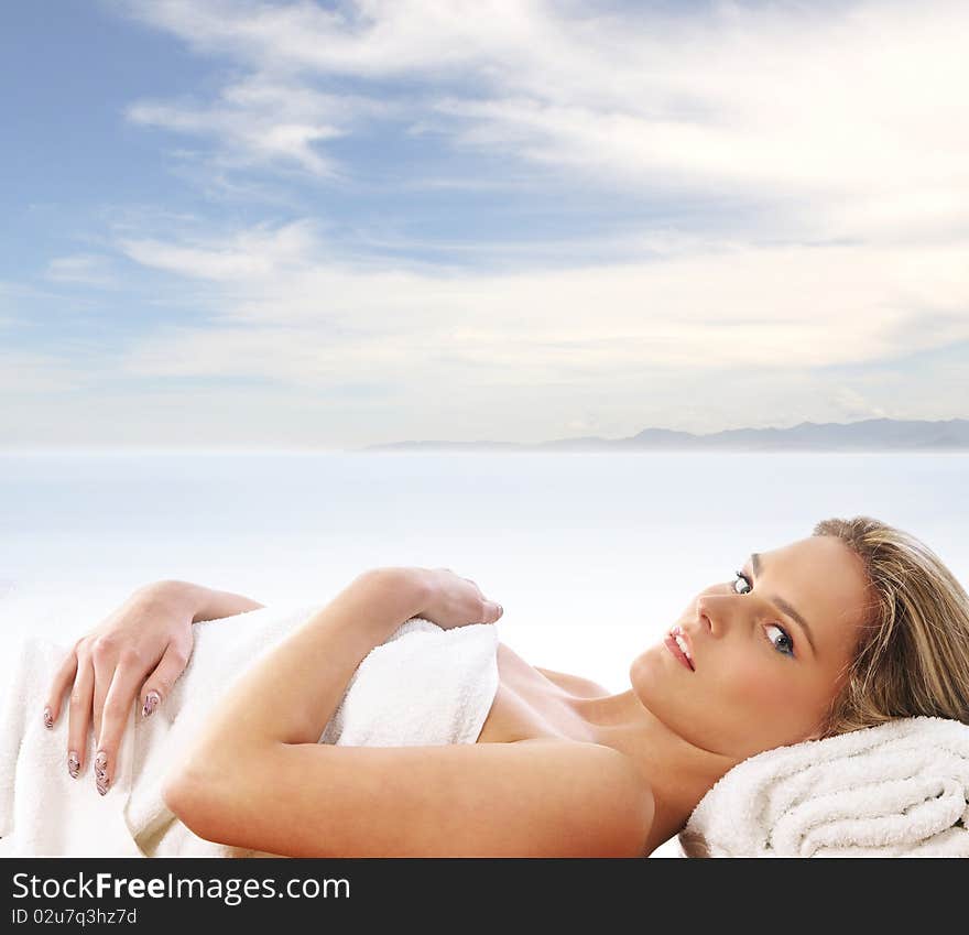 A Young Blond Girl On A Resort Background