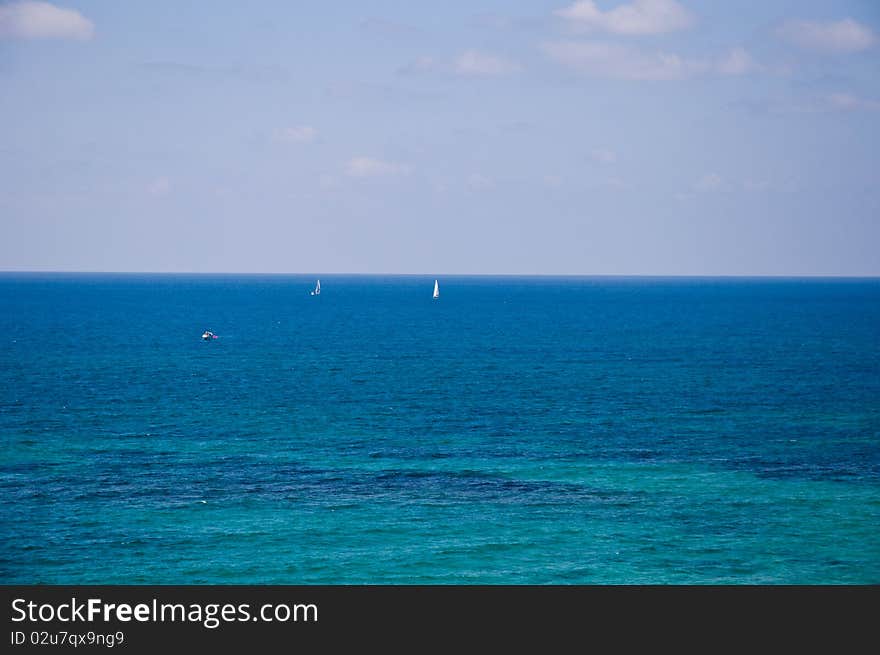 The sea in sunny, clear, windless day. The sea in sunny, clear, windless day.