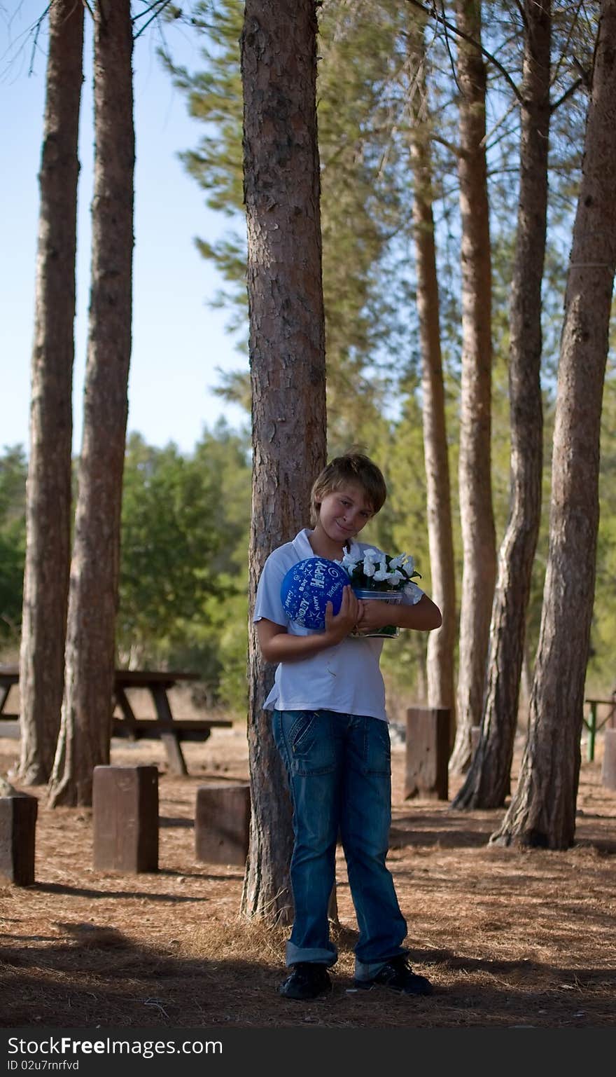 Boy with balloons and gifts.