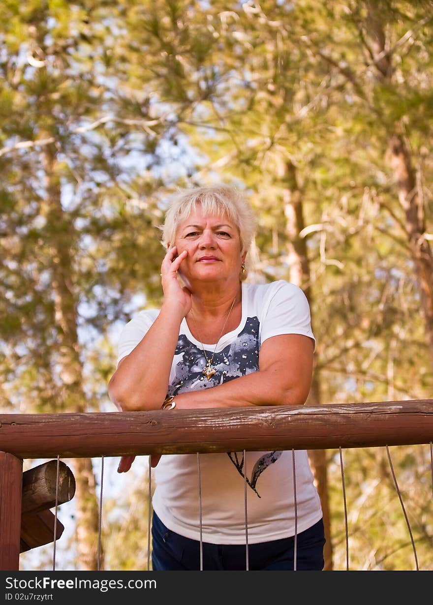 Casual portrait of happy mature woman with minimal makeup. Casual portrait of happy mature woman with minimal makeup.