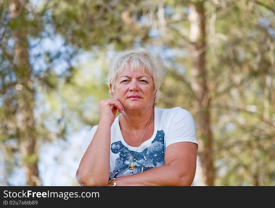 Casual portrait of happy mature woman with  minimal makeup. Casual portrait of happy mature woman with  minimal makeup.