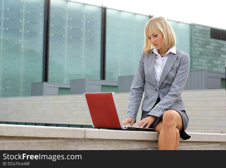 A Young Business Woman Working With A Laptop