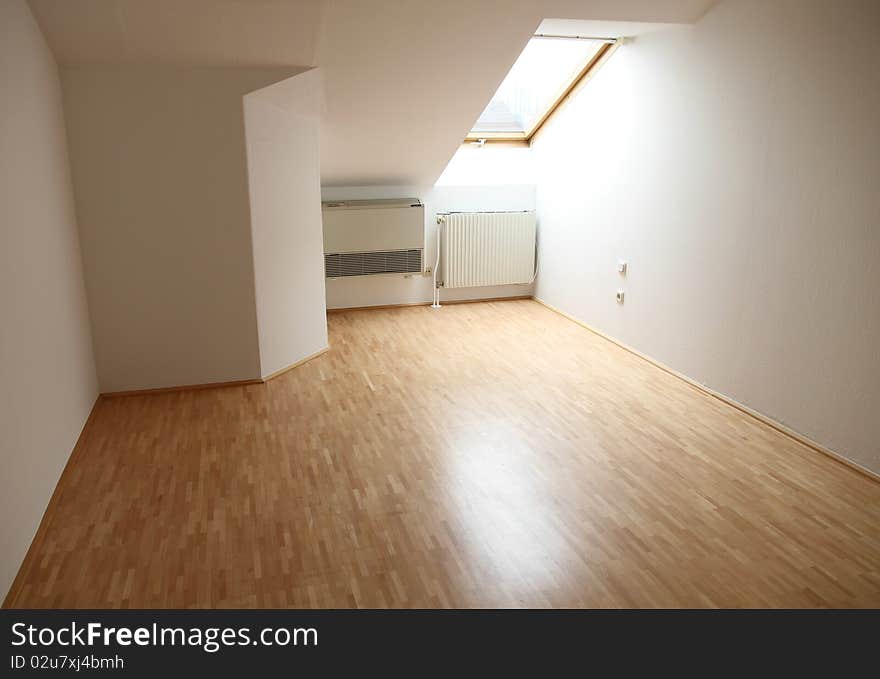 Bedroom in a penthouse with parquet floors