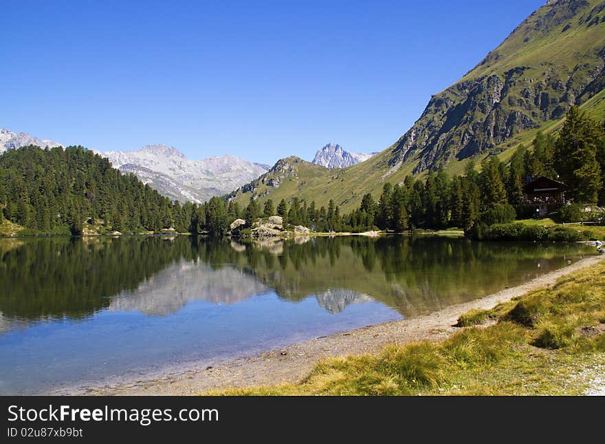 Alpine lake Cavloc Engadine in Switzerland