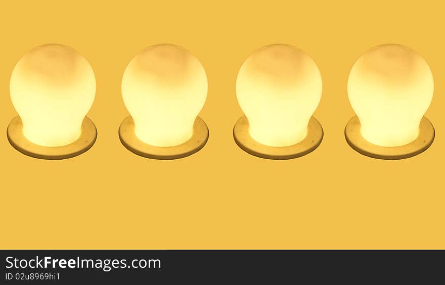 Glowing Yellow Incandescent Light Bulb.