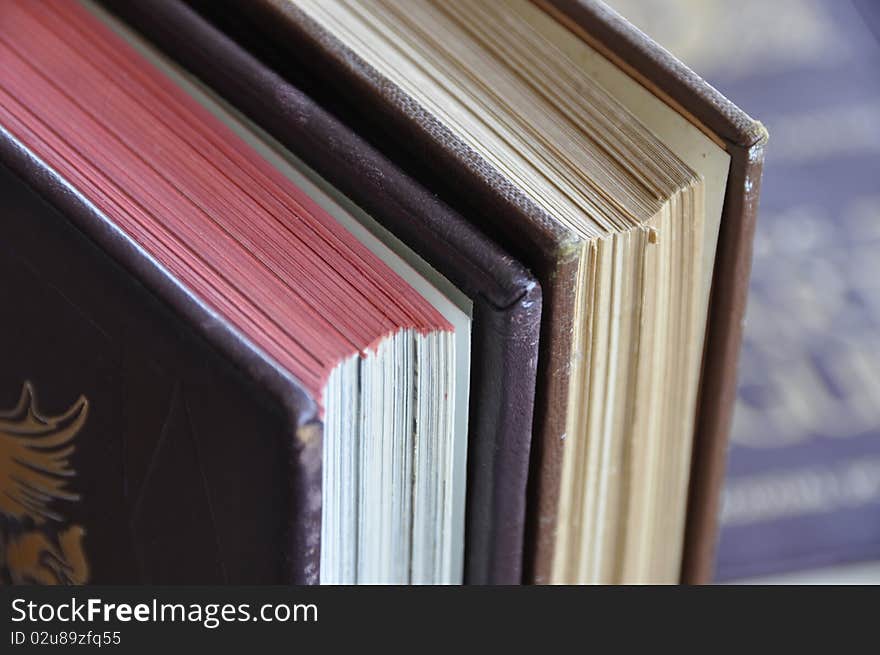 Old books over manuscript background