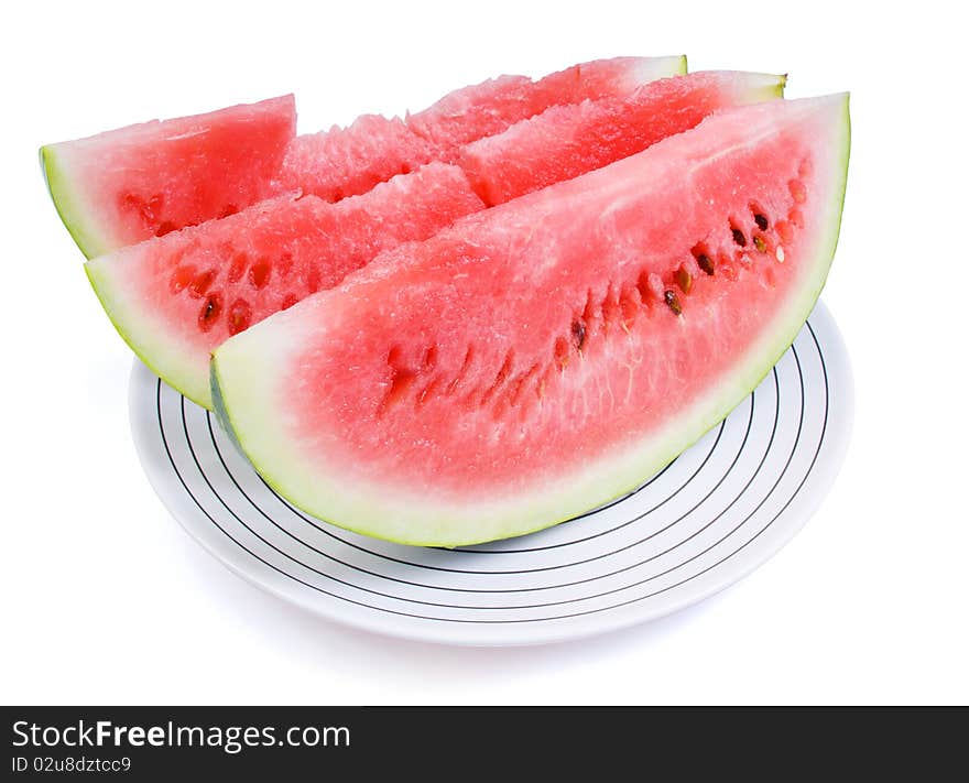 Three portions of a water-melon on a white plate