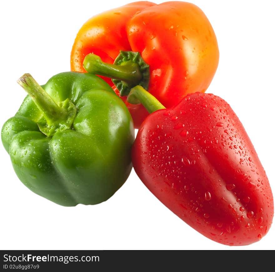 Three peppers isolated red green and orange. Three peppers isolated red green and orange