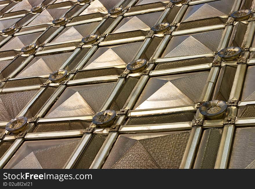 Wall of the bulk glass  tiles different sizes and shapes