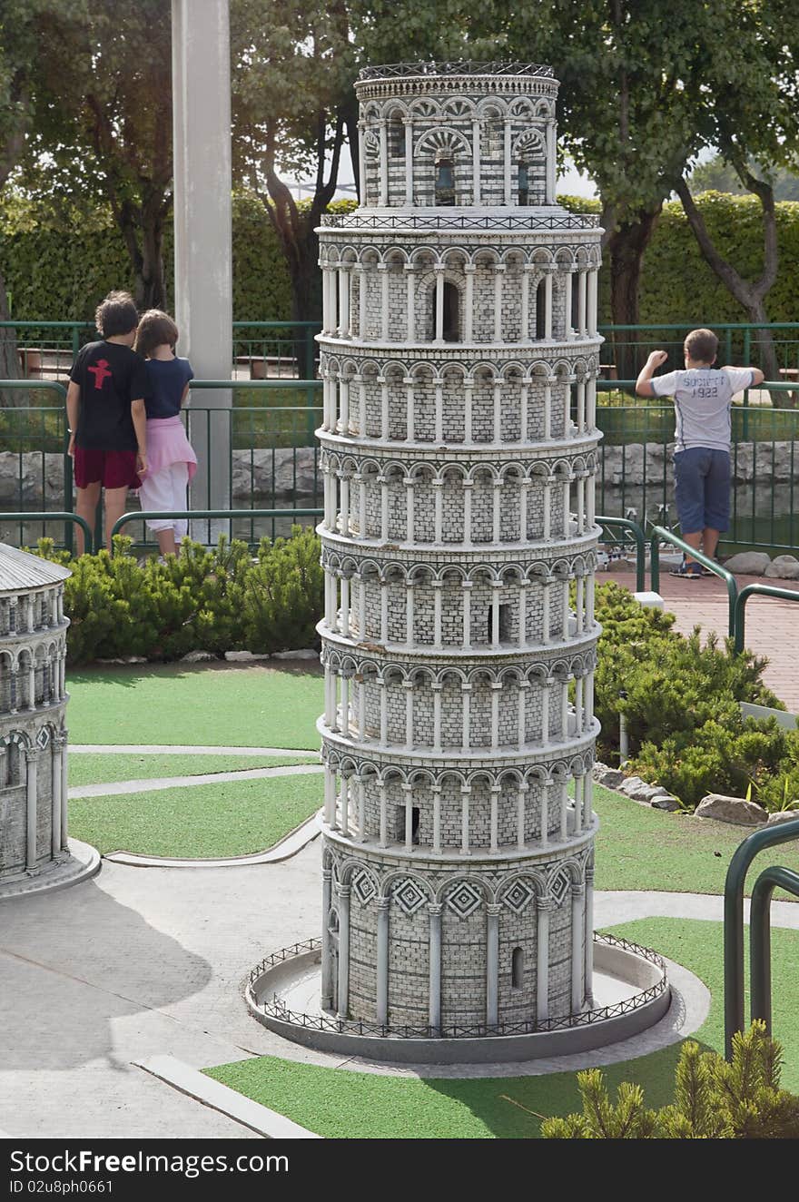 Tower of pisa miniature in park with childrens