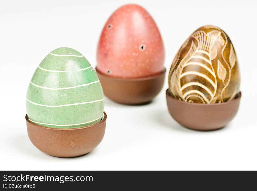 Three stone eggs on a white background