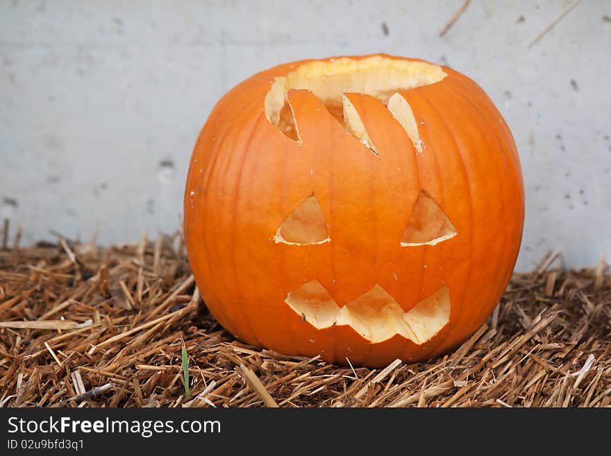 Halloween pumpkin against the wall