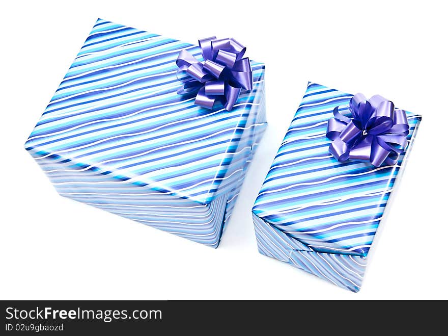 Two blue paper gifts boxes with bows. Isolated on white. Two blue paper gifts boxes with bows. Isolated on white.