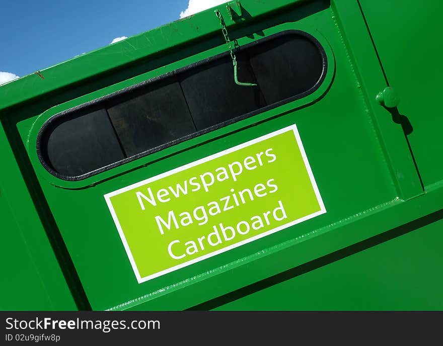 Closeup of green colored paper waste container. Closeup of green colored paper waste container