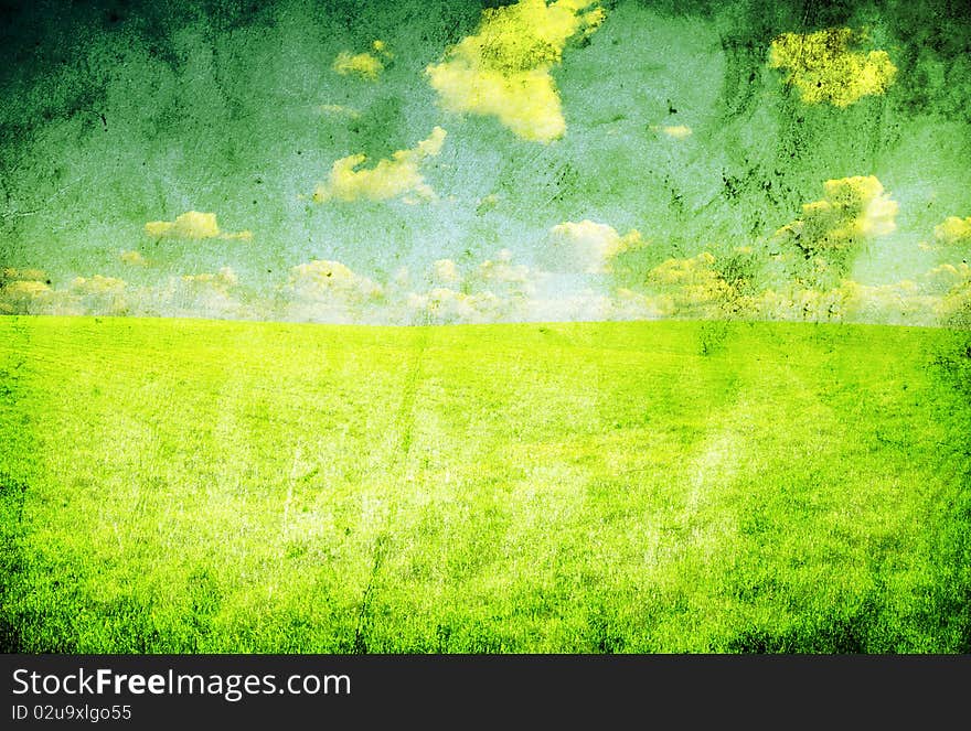 Field on a background of the blue sky