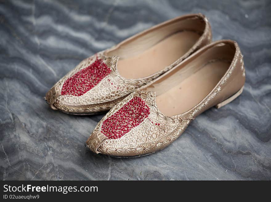 Closeup shot of punjabi wedding shoes.