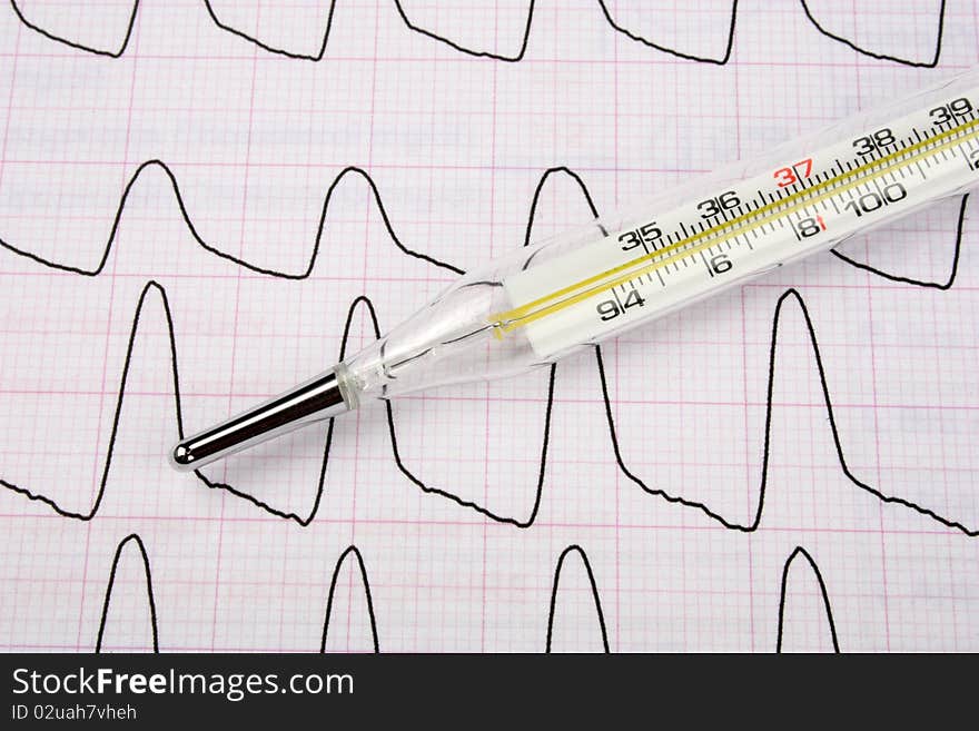 Medical Thermometer On A Report