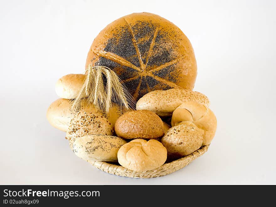 Fresh bread in the basket on the white background