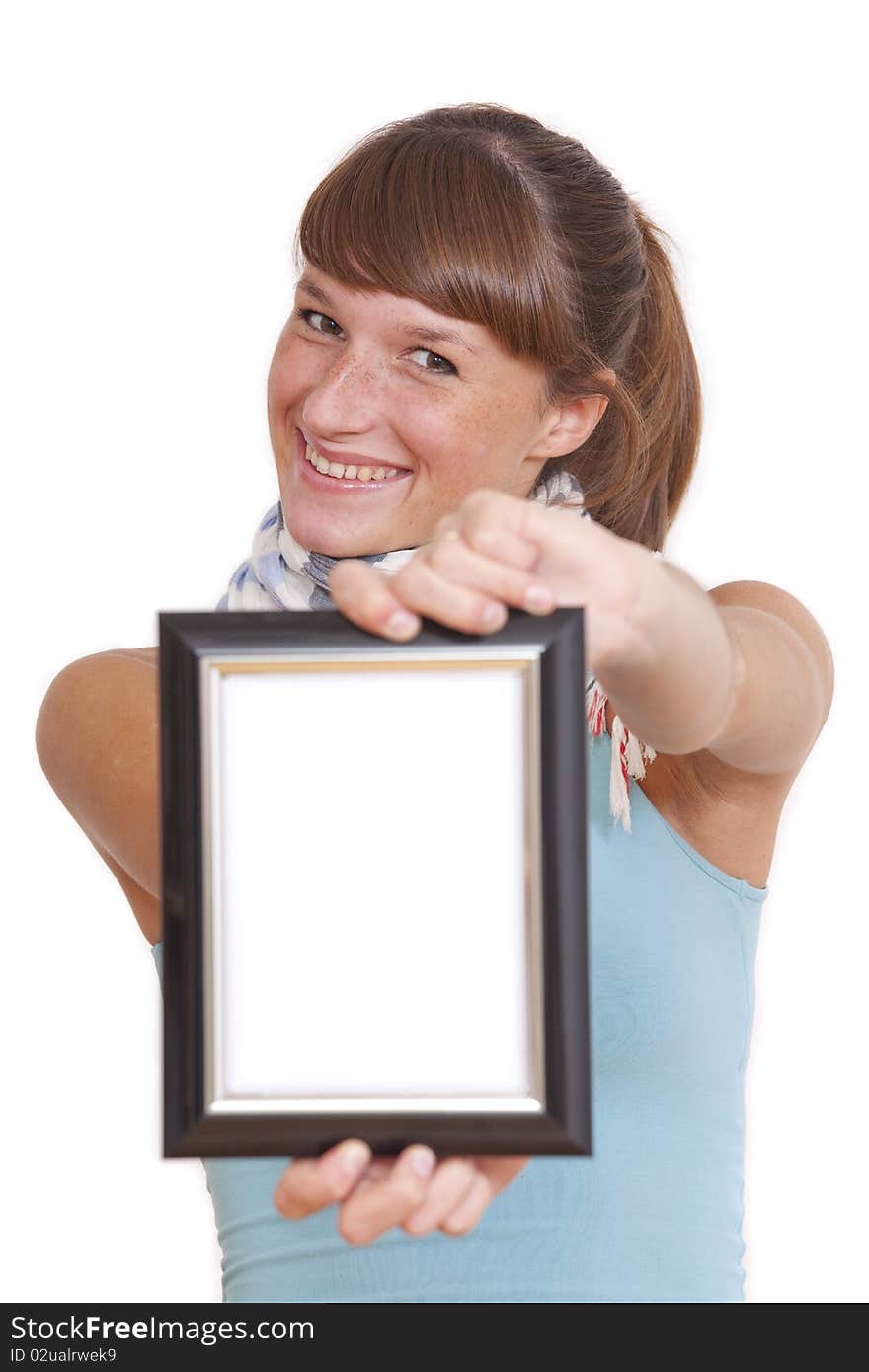 Smiling woman showing empty picture frame in the camera - isolated. Smiling woman showing empty picture frame in the camera - isolated