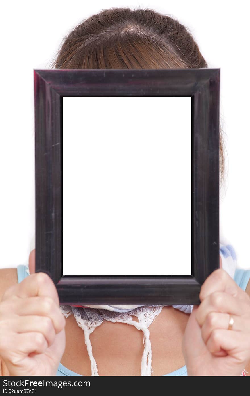 Woman holding empty picture frame for your own face. Woman holding empty picture frame for your own face