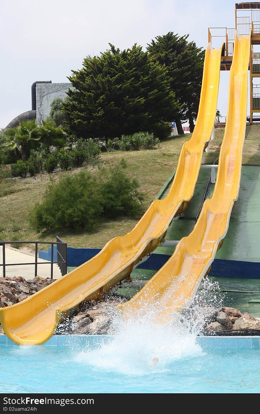Two yellow slides in the water park. Two yellow slides in the water park