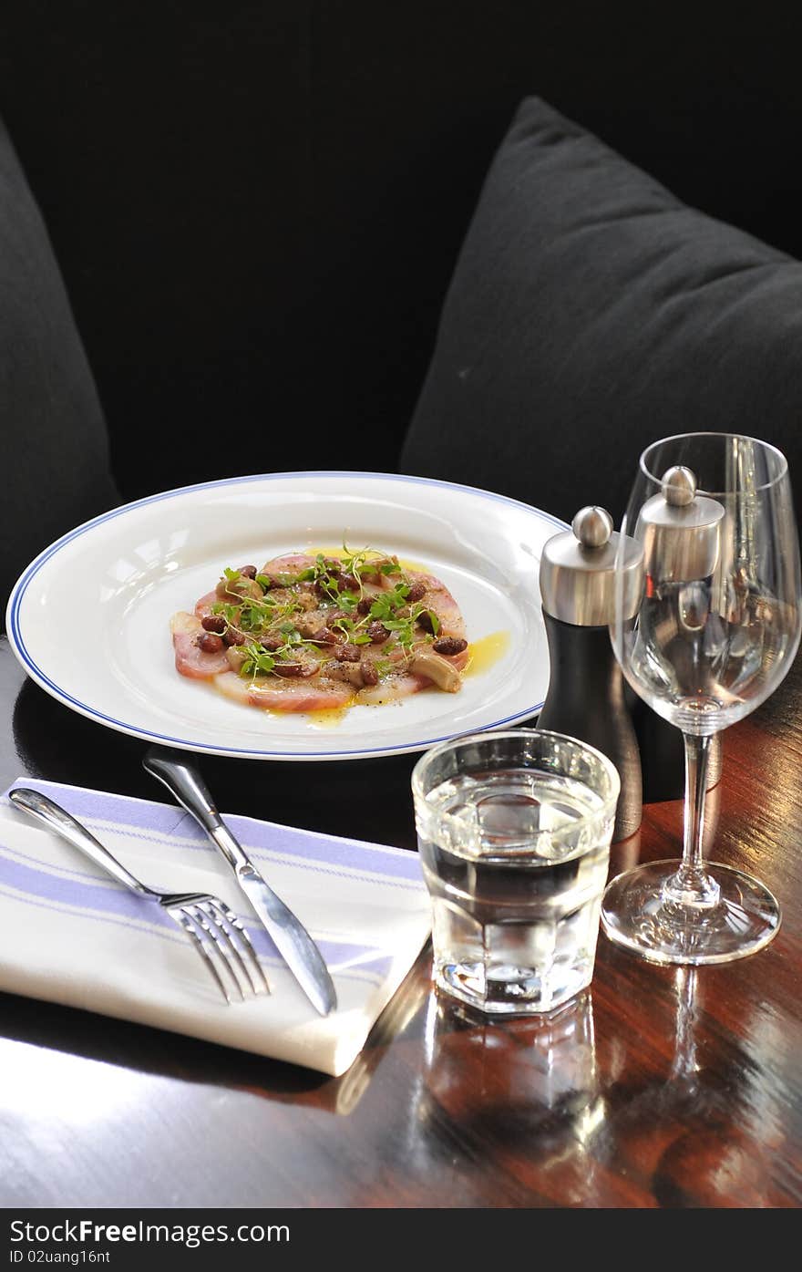 Amberjack carpaccio ready on table. Amberjack carpaccio ready on table