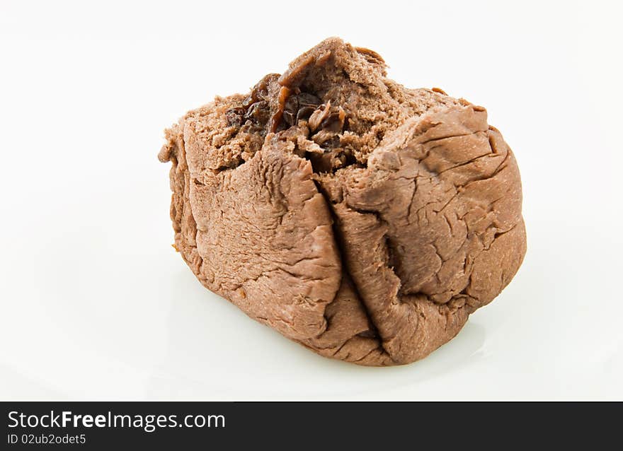 A bite of chocolate bread with raisin stuff