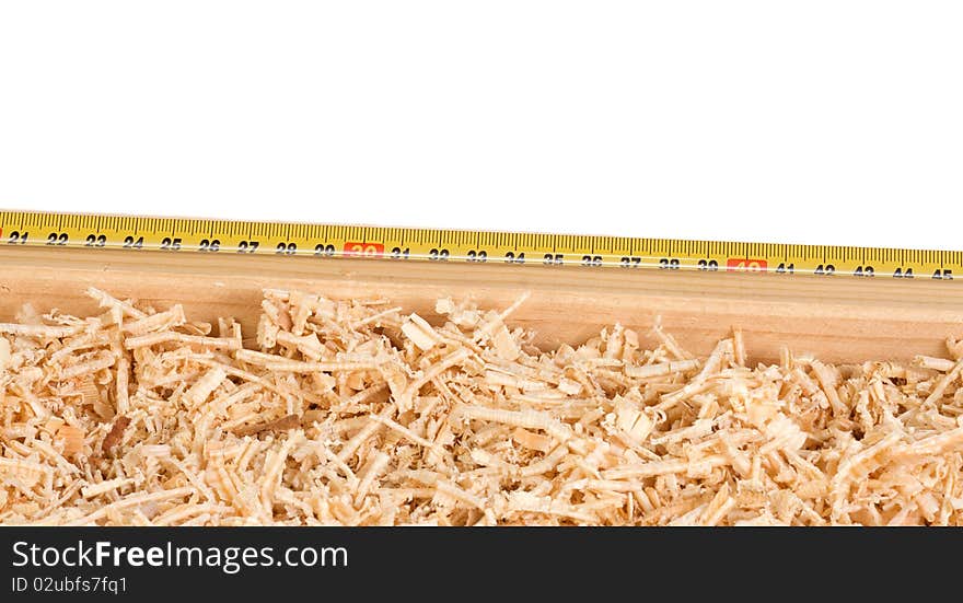 Tape measure and wood sawdusts. Tape measure and wood sawdusts