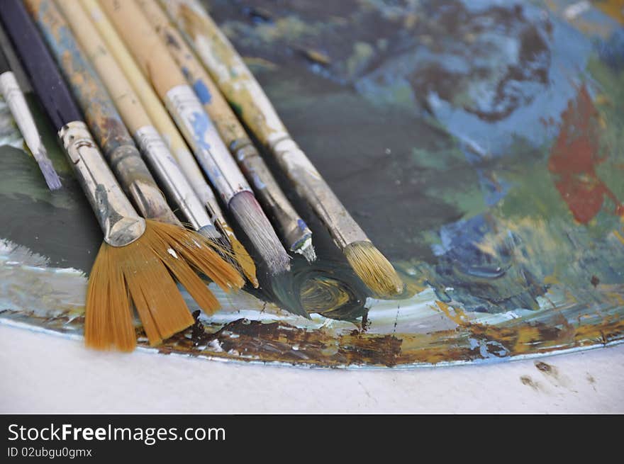 Set of bristles over paint smudges. Set of bristles over paint smudges