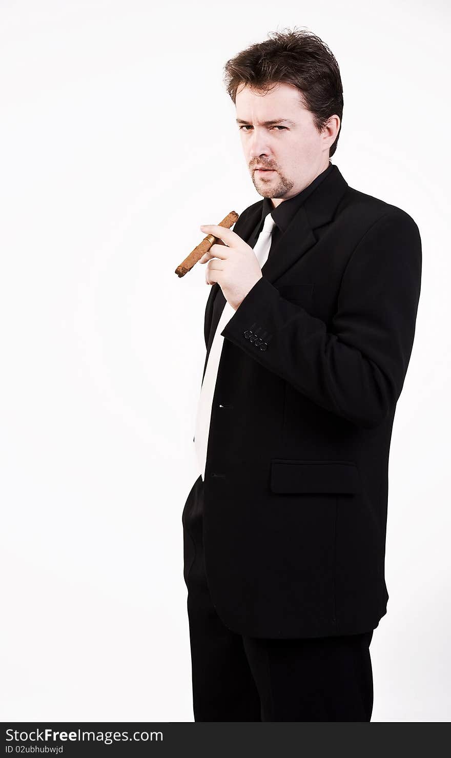 Business man in black suit with cigar. Business man in black suit with cigar