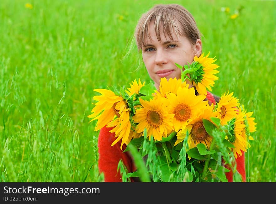 Girl with sunflower in hands