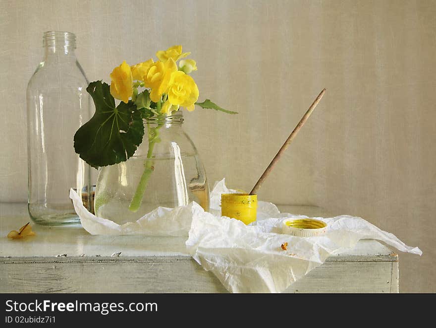 Still life with a yellow flower