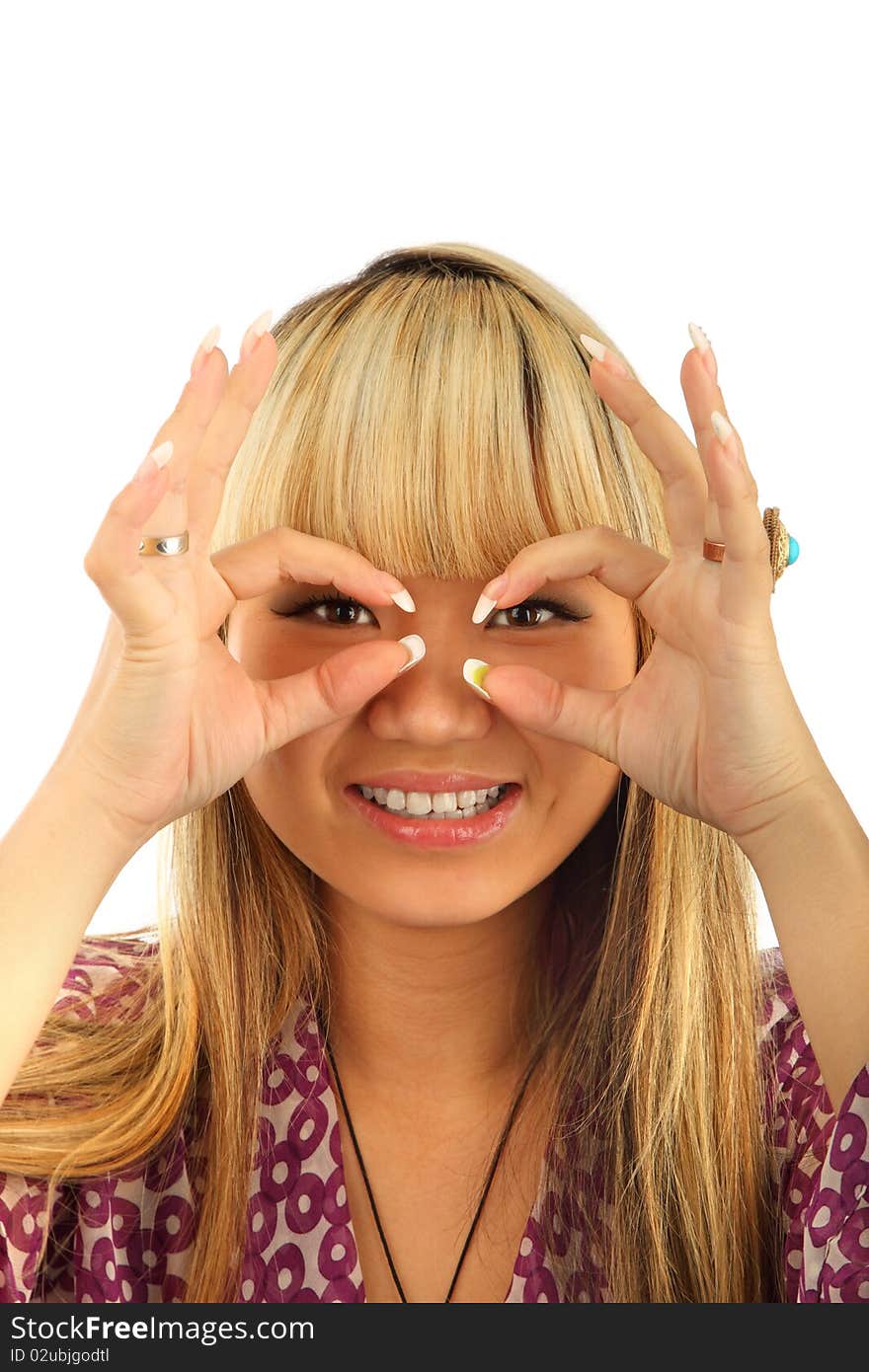 Happy young woman looking through circled finger isolated