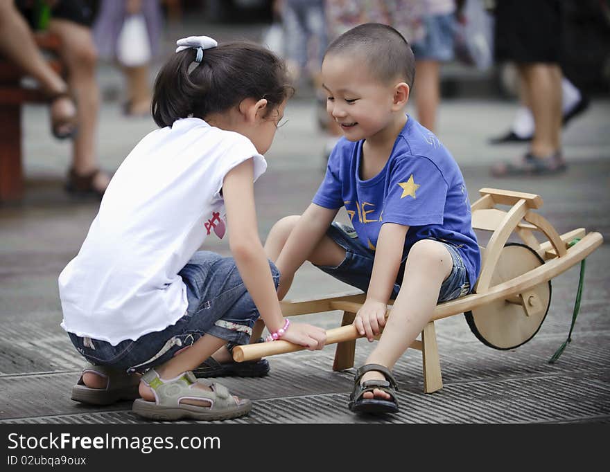 Sister and brother play wood trolley. Sister and brother play wood trolley.