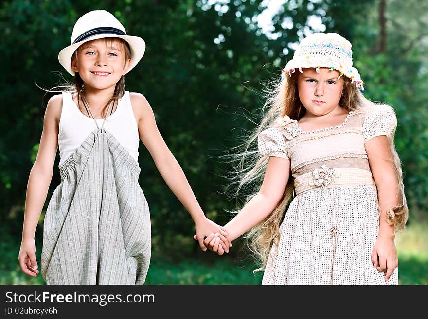 Two beautiful children walking together. Retro style. Two beautiful children walking together. Retro style.