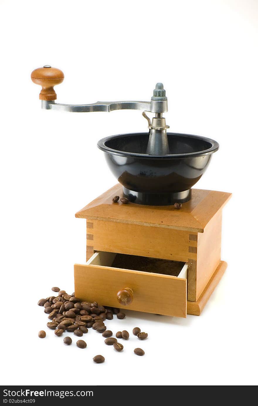 Coffee mill with beans on white background