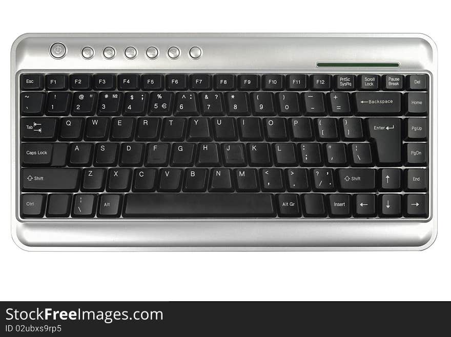 Wireless metallic keyboard isolated with clipping path over white background. Wireless metallic keyboard isolated with clipping path over white background