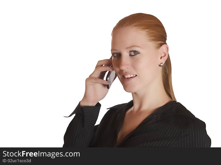 Young red haired lady talking on the phone. Young red haired lady talking on the phone