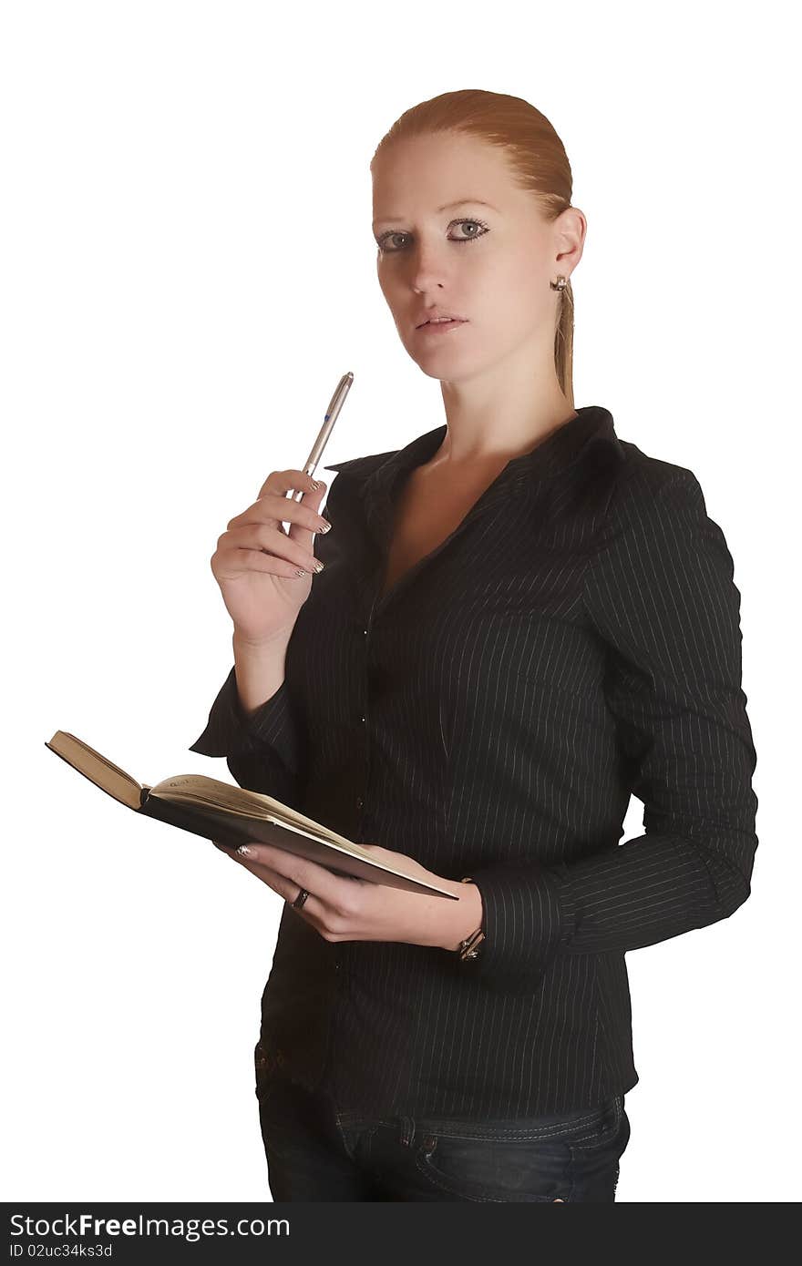 Young red haired lady thinking with her notebook and pen. Young red haired lady thinking with her notebook and pen