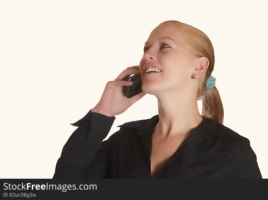 Young red haired lady talking on the phone. Young red haired lady talking on the phone